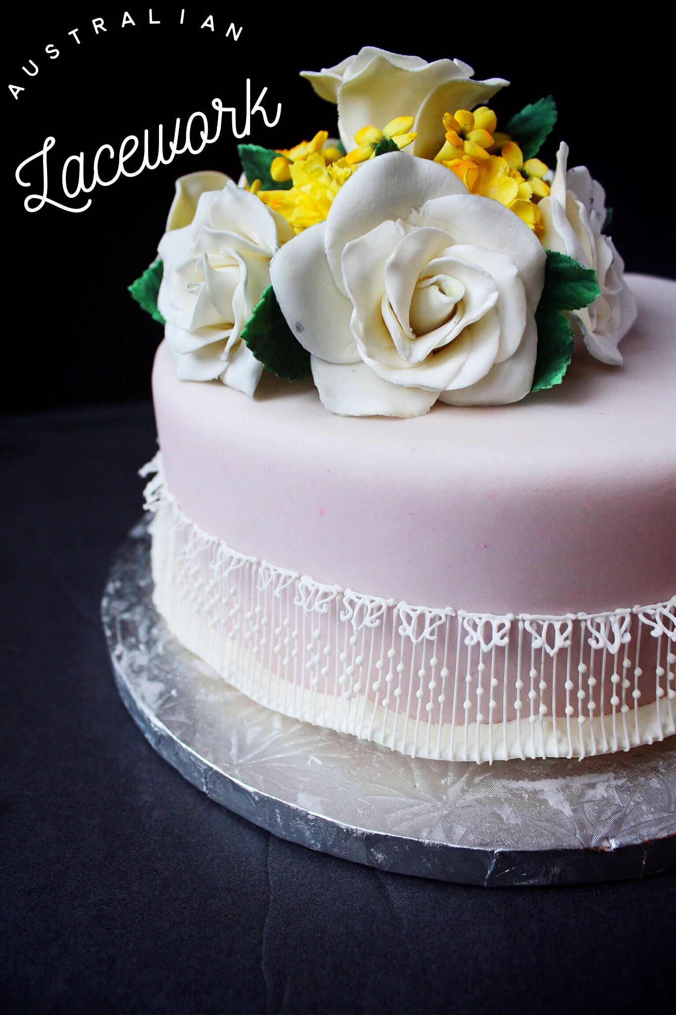 Gumpaste flowers and hand piped lacework
